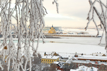 Winter city landscape. Temple on the river Bank on the background of snow-covered trees. Winter in Russia. Alexander Nevsky Cathedral
