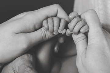 baby newborn premature with hands and feet parents caring loving