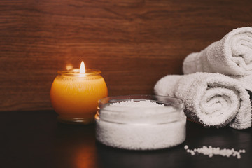 spa setting with candles and white towel