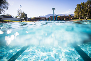 Wide angle underwater photo inside an olympic sized swimming pool with racing lanes