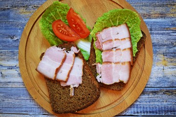 Smoked bacon, sliced on a wooden Board. Smoked bacon.