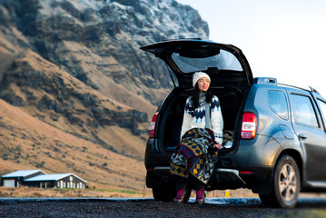 Female traveler enjoying Iceland view from the car