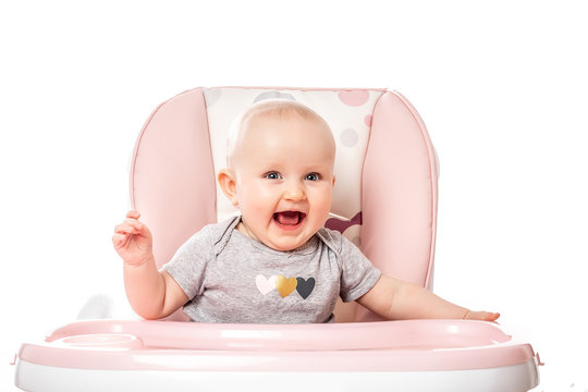 surprised kid sitting In High Chair. child's eyes widened and mouth opened in amazement. Isolated on white background copy space for your text