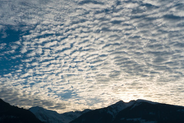 silhouette mountain landscape winter evening with fantastic cloudscape