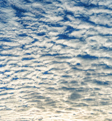 background of fantastic white cloudscape in blue sky at sunset