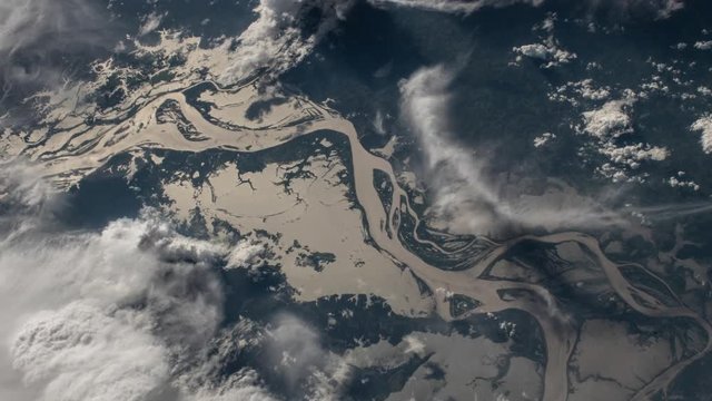 Amazon river and lakes satellite view, moving clouds animation, contains public domain image by Nasa