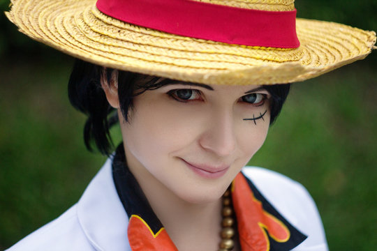 Cosplay of boy girl with straw hat smile. Japanese famous cosplay.
