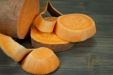 Sweet potato Ipomoea batatas on rustic wood table