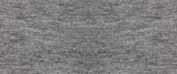 Fototapeta na wymiar Gray fabric texture background of dark grey colored shirt. Cloth surface and material design for empty backdrop, modern fashion clothes simple pattern. Blank apparel canvas and copy space 