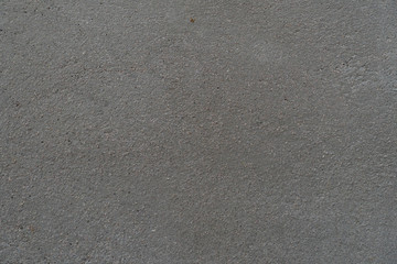 New cement floor that has not been painted for background and texture.