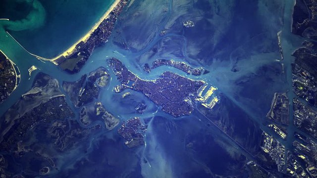 Venice Italy aerial satellite view night to day sunrise animation. Contains public domain image by Nasa