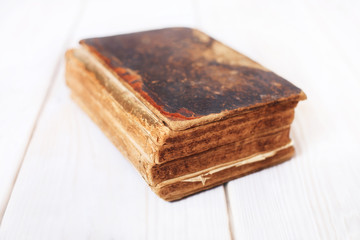 Old book on a white boards background.