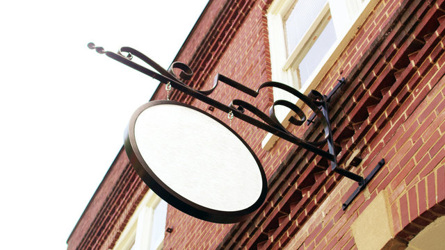empty sign poster on brick wall