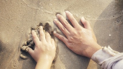 Hands on sand