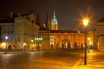 Fototapeta na wymiar Prague - The Hradcanske square, Castle and St. Vitus cathedral at night.