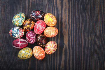 Easter decorated eggs on a wooden background.