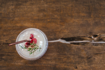 Fresh rasberry cream soda, cold drink or beverage with ice on  wooden background, top view