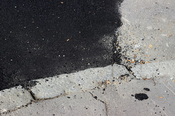 New and old asphalt surface patch city street