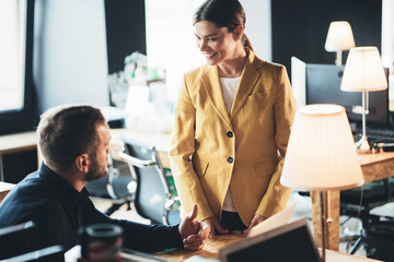 Two people discussing work problems in the company office