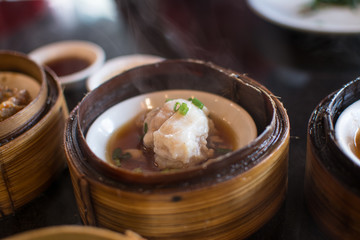 Chinese dim sum in a bamboo steamer box