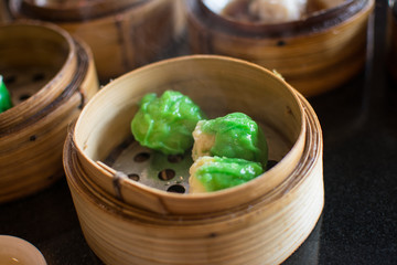 Chinese dim sum in a bamboo steamer box