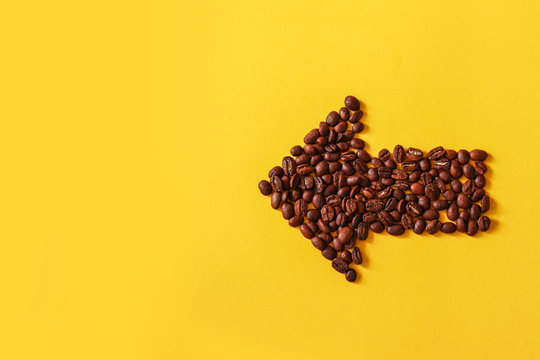 Coffee beans in the form of arrows isolated 