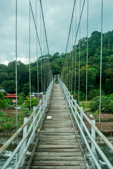Fototapeta na wymiar Hanging bridge in Bukit Lawang, Sumatra, Indonesia.