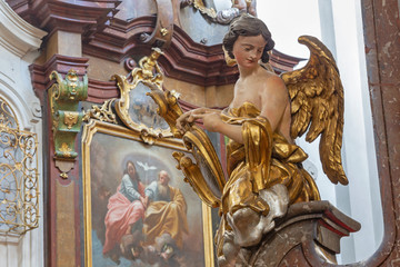 Fototapeta na wymiar PRAGUE, CZECH REPUBLIC - OCTOBER 12, 2018: The carved polychrome baroque statue of angel from the side altar in St. Francis of Assisi church by M. V. Jäckel a J. K. Liška. (17. - 18. cent.).