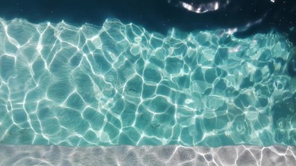 Empty swimming pool above top view on sunny day. Cleaning pool service