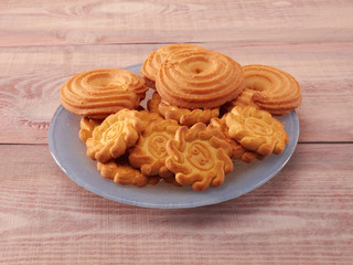 Cookies of different types on a wood background