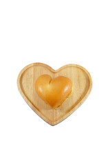 Heart shaped hamburger on wooden plate isoated on white background.