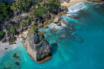 Naklejka na ściany i meble Diamond beach, aerial view, Nusa Penida, Bali, Indonesia. Beautiful beach with turquoise water, white sand and large rocks