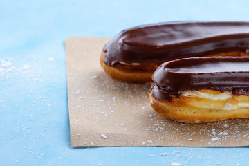 Traditional french dessert. Delicious eclairs with custard and chocolate icing for sweet tooth. Pastry products.