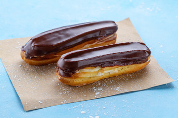 Traditional french dessert. Delicious eclairs with custard and chocolate icing for sweet tooth. Pastry products.