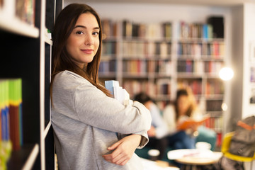 Smiling student in library