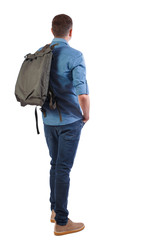 Naklejka premium Back view of a man with a green bag.