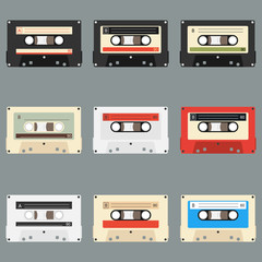 Fototapeta premium Old audio cassettes gray background. Collection of vector retro audio cassettes. Set of different colorful music tapes. Isolated on gray background.