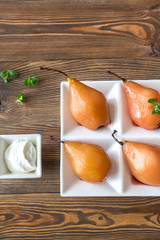 Poached pears on the plate