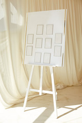 Easel at the wedding with a list of seating guests at the celebration