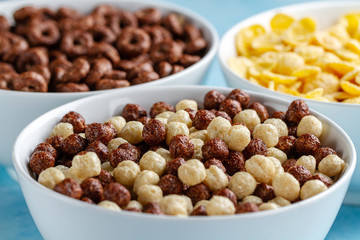 Cereals and dry breakfast of chocolate balls, rings and corn flakes