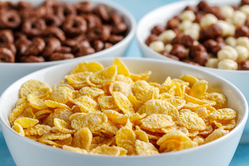 Cereals and dry breakfast of chocolate balls, rings and corn flakes