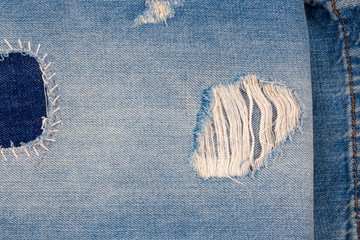 Fototapeta na wymiar Closeup of blank jeans patch on inner side of worn blue denim