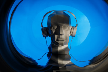 Silhouette of a cyber digital head in a headphones as a dj