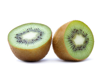 Two isolated halves of ripe kiwi fruit on white background