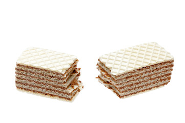 Isolated chocolate cracked crispy wafers with crumbs on white background. Food and snack for sweet tooth