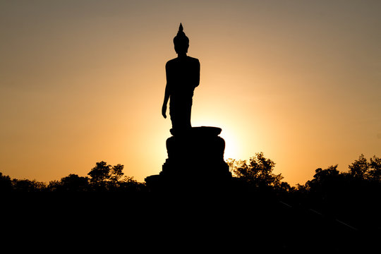 Buddha image and sunset light