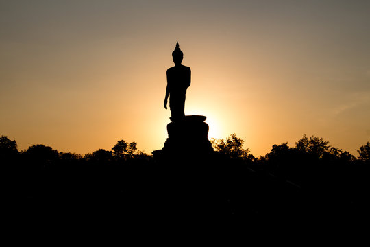 Buddha image and sunset light