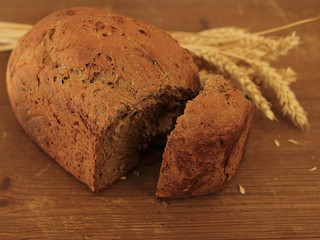 Bread and ears of wheat on the tabletop