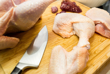 Chipped chicken on a wooden cutting board