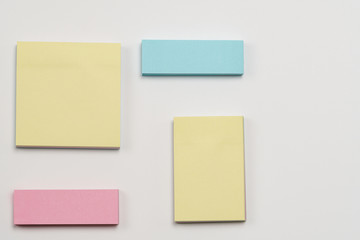 Multi-colored paper notes on a white background.
